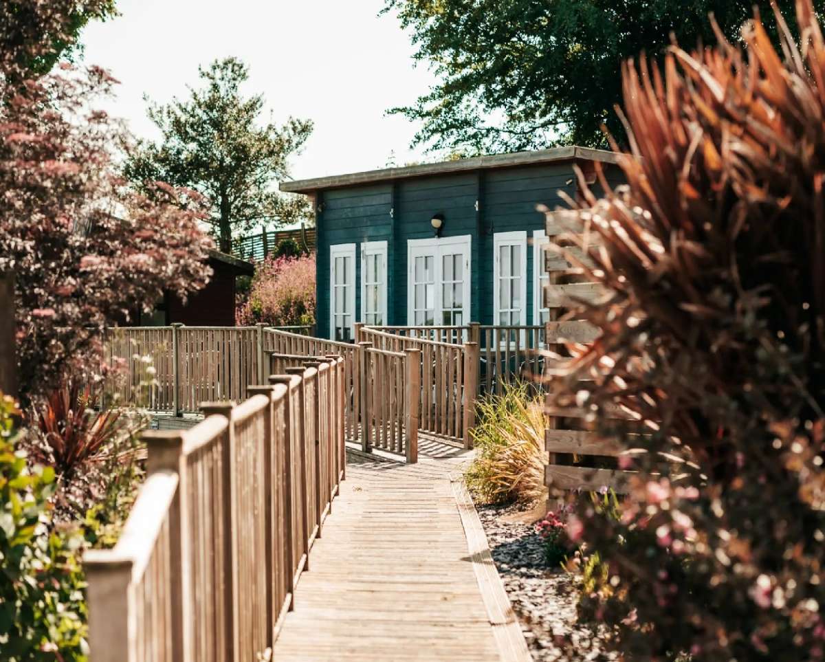 The Cosy Café is tucked away in a rustic wooden cabin, overlooking the pool and beautiful Cornish landscape.